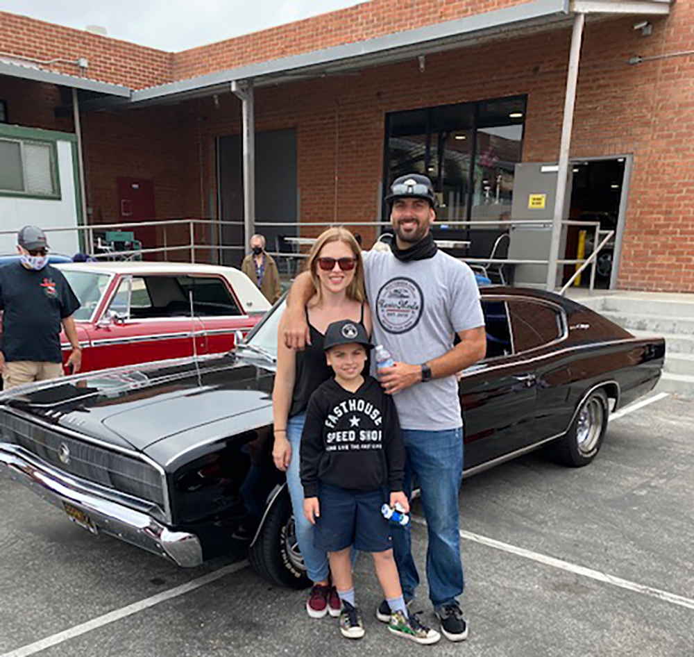 Ron, Katie, 8-year-old son Tex, and their best friends 1966 Charger